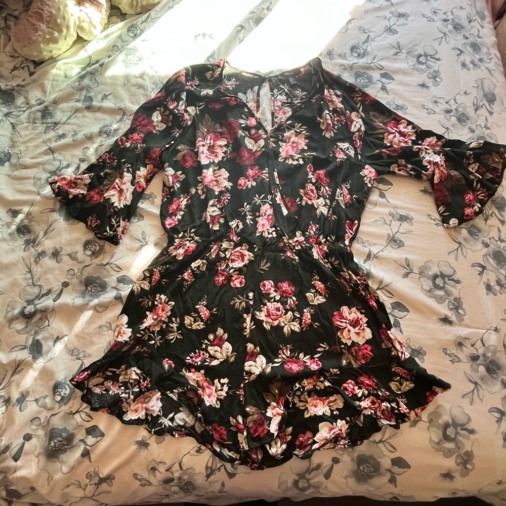 Black, floral romper in the size 2X. Thin material, very comfortable and pretty